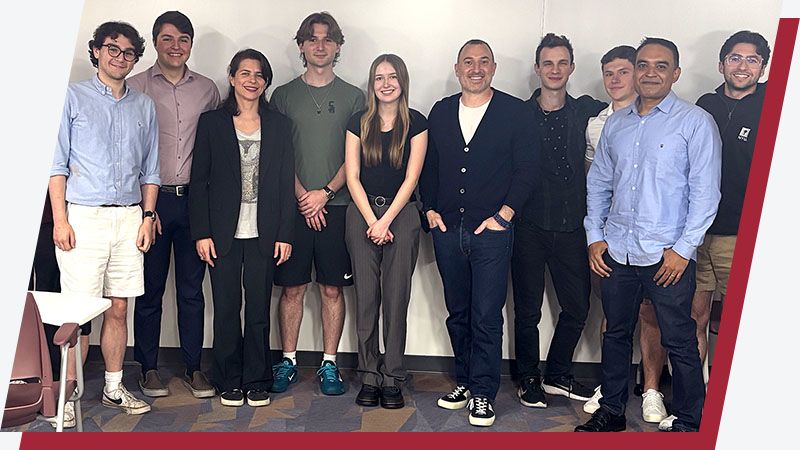 A group portrait of seven iSTEM students with two professors