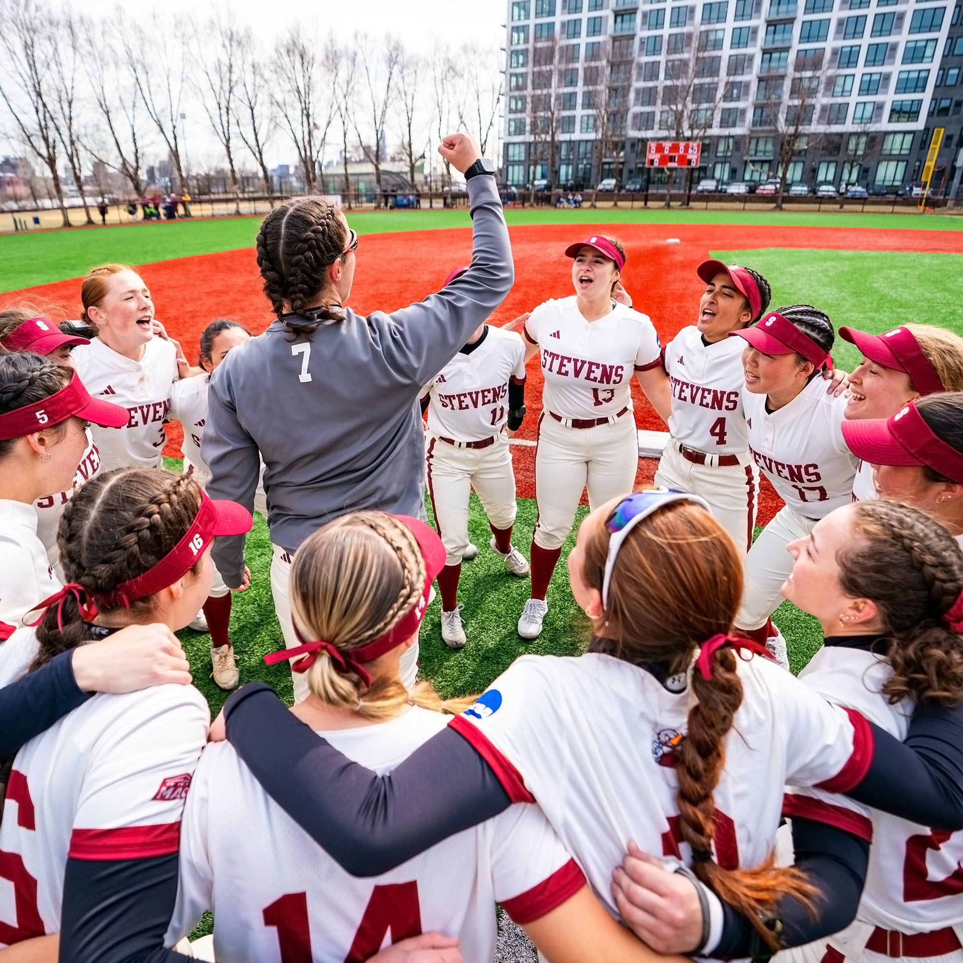 Stevens womens softball team rallying for a game.